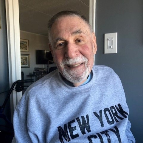 A Man in a a New York City Sweatshirt